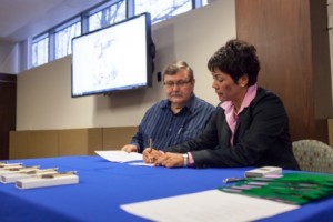 Ninilchik Natives Association President and CEO Greg Encelewski and CIRI President and CEO Sophie Minich at the March 1 ceremony, signing the quick claim deed to convey Ninilchik's 12(b) land selections.
