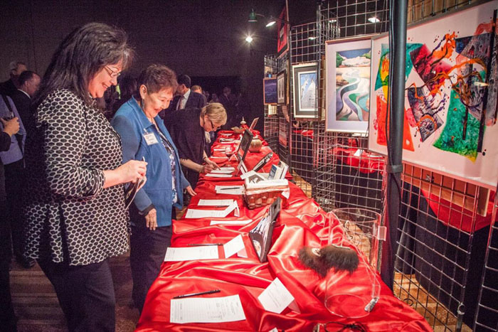 Participants in the silent auction portion of the Alaska Native Art Auction.