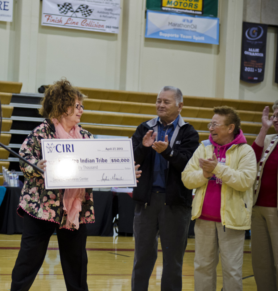 Members of KIT accepting CIRI's donation at the Kenai shareholder meeting.