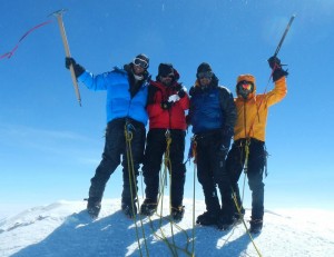 2013 Denali Centennial Climb team at the summit June 28: (left to right) Dana Wright representing Walter Harper, Ken Karstens representing Harry Karstens, Sam Alexander representing Jon Fredson and Esias George, and Dan Hopkins representing Hudson Stuck.