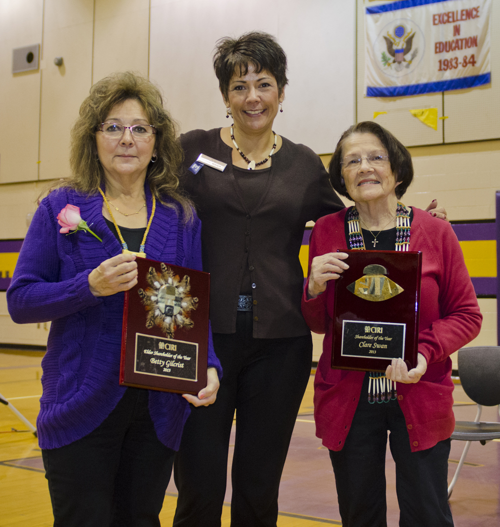 CIRI President and CEO Sophie Minich presented CIRI shareholders Betty Gilcrist and Clare Swan with their award plaques at the Kenai Friendship Potlatch.  Photo by Joel Irwin.