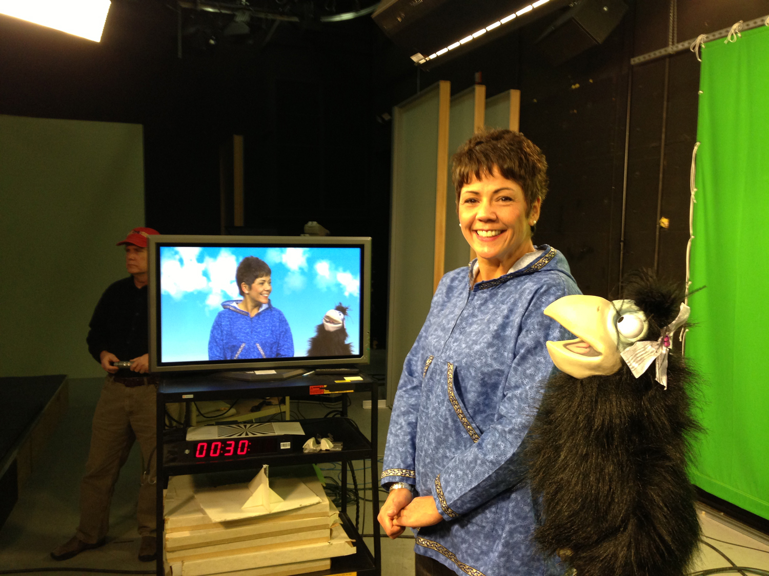 CIRI President and CEO Sophie Minich appears with Raven to film a promotional ad for In My Family.  Photo by Jason Moore.