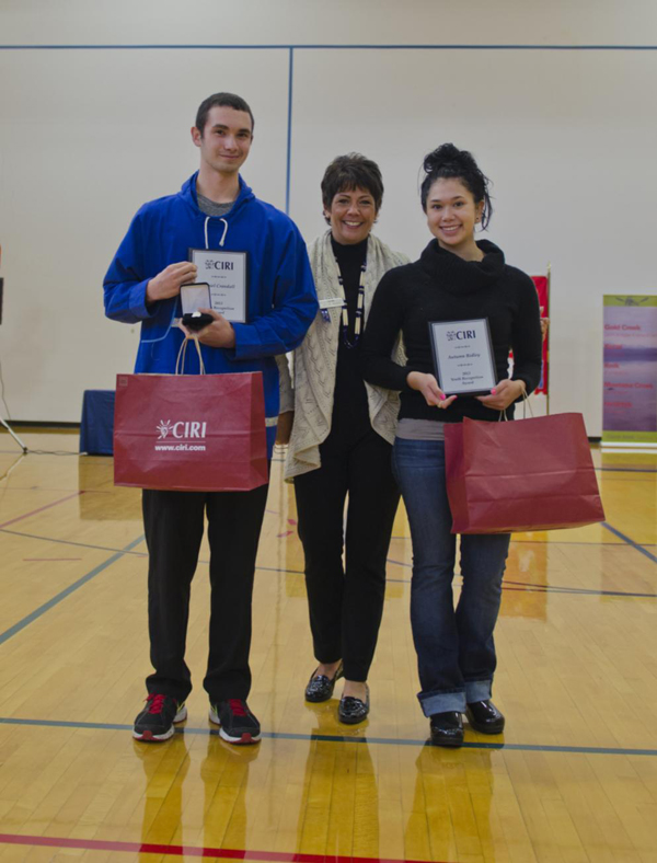 2013 Youth Recognition Award recipients, Amiel Crandall and Autumn Ridley pictured with CIRI President and CEO Sophie Minich at the Anchorage Potlatch. Photo by Joel Irwin.