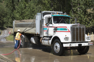A dump truck being decontaminated by North Wind employees after dumping its load at the Big Creek Repository.