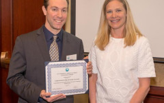 Allison Nyholm of Senator Lisa Murkowski’s office presents the 2015 Charles L. Edson Honorable Mention for Senior Housing to Gabe Layman of Cook Inlet Housing Authority for Coronado Park Senior Village in Eagle River.
